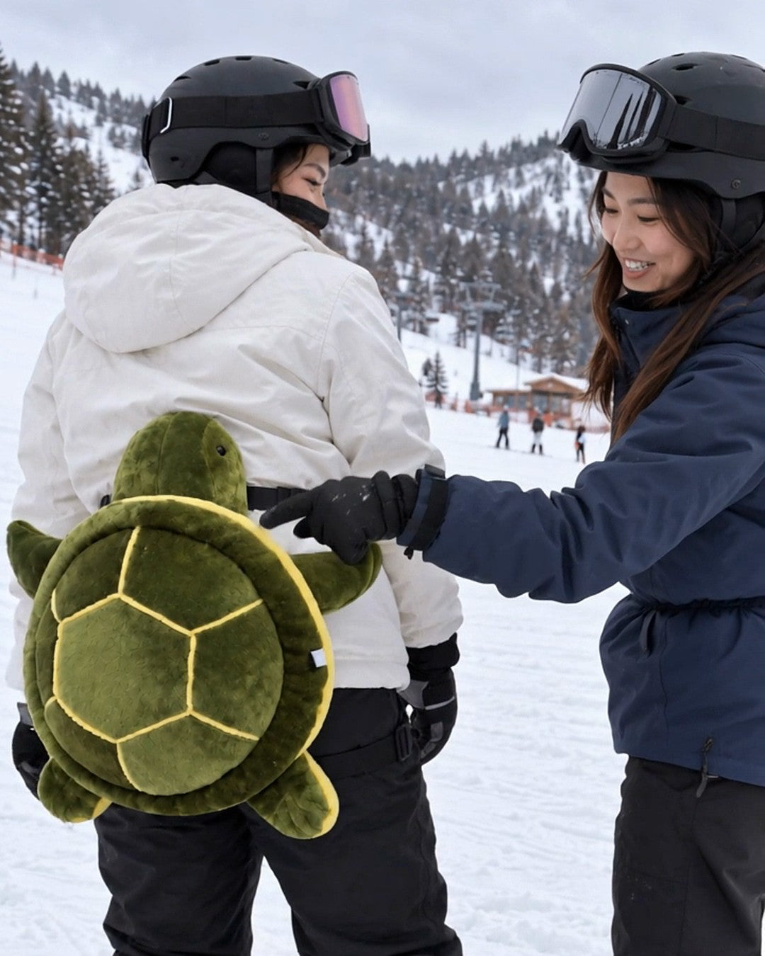 Friend laughing and patting the turtle bum pad